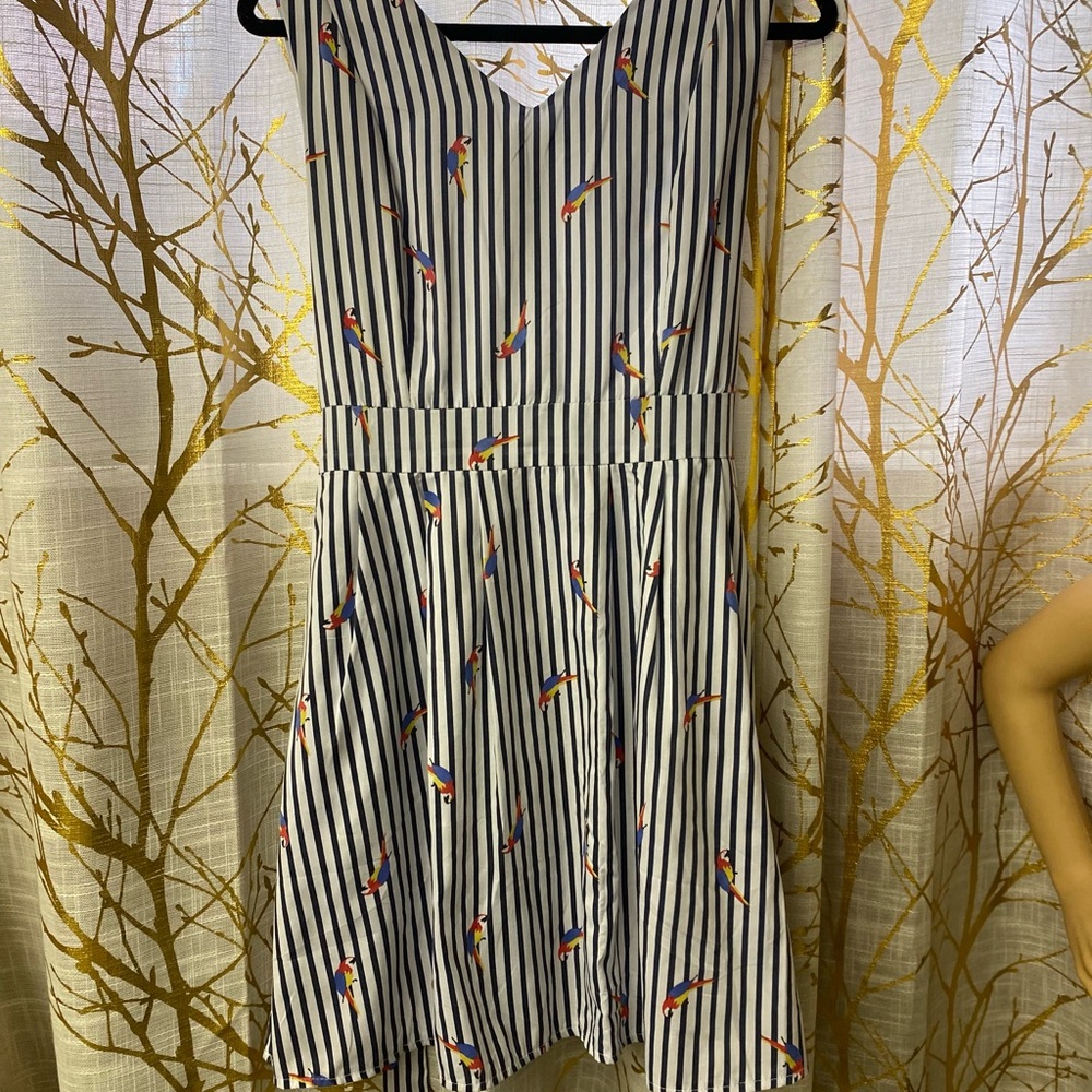 Cute little cotton dress with pockets and parrots.Above the knee.Buy one get one